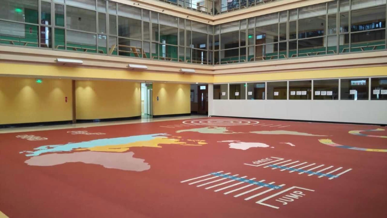 World map, chess and hopscotch patterns printed into the SPORTEC atrium floor